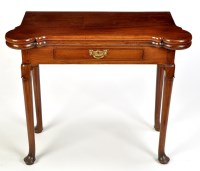 Lot 920 - A Georgian mahogany card table, the hinged top...