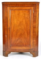 Lot 921 - A late Georgian mahogany standing corner...