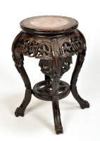 Lot 959 - An Oriental carved padauk wood jardiniere...