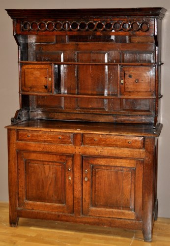 Lot 1016 - An 18th Century oak dresser, the raised back...