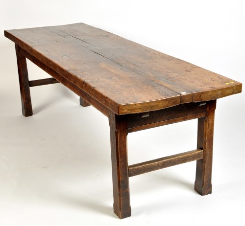 Lot 1017 - An antique elm refectory table with rustic...