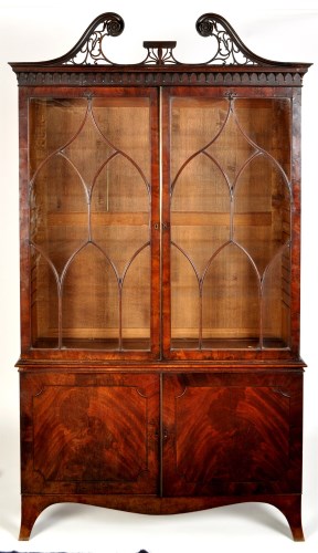 Lot 1020 - A George III mahogany cabinet with pierced...