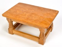 Lot 1021 - A rectangular oak Mouseman stool, the lightly...