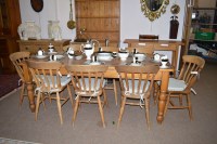 Lot 845 - A modern rectangular pine kitchen dining table...