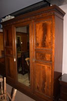 Lot 1025 - An Edwardian inlaid mahogany three door...