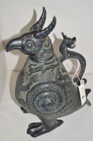 Lot 306 - An Asian metal jug in the form of a mythical...