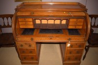 Lot 826 - A late 19th Century cylinder bureau, the lid...