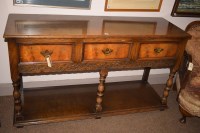 Lot 614 - A reproduction oak side table, fitted three...