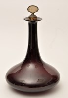 Lot 1029 - A purple glass decanter, of squat baluster...
