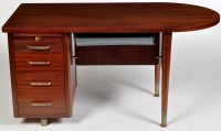 Lot 1149 - Abbess: a mid 20th Century teak desk, with...