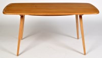 Lot 1155 - Ercol: a light elm and beech wood dining table,...