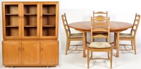 Lot 1163 - Ercol: a light elm dining room suite,...