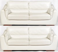 Lot 1171 - A pair of modern white leather two-seater...