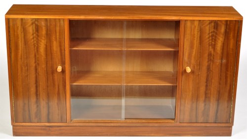 Lot 1179 - A mid 20th Century Afromosia bookcase cabinet,...