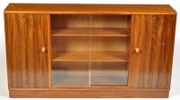 Lot 1179 - A mid 20th Century Afromosia bookcase cabinet,...