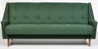 Lot 1187 - A 1960's sofa bed, upholstered in buttoned...