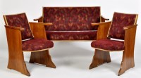 Lot 1195 - An Art Deco oak three-piece suite, with padded...
