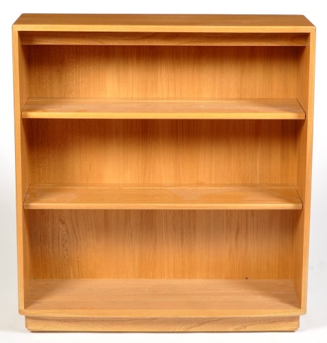 Lot 1197 - Ercol: a light elm open bookcase, with bowed...