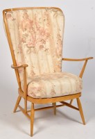 Lot 1201 - Ercol: a beech wood wing style easy armchair.