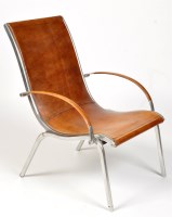 Lot 1220 - A modern steel and leather armchair, the...
