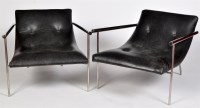 Lot 1221 - Two modern black-buttoned leather and chrome...