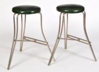 Lot 1224 - A pair of mid 20th Century and leather stools,...