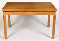 Lot 1237 - A Danish style teak extending dining table,...