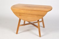 Lot 1253 - Ercol: a pine drop leaf dining table, the oval...
