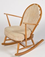 Lot 1255 - Ercol: a beech wood and elm rocking chair,...