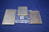 Lot 503 - Three silver cigarette cases with engine...