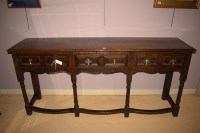Lot 1261 - A Georgian style stained oak dresser fitted...
